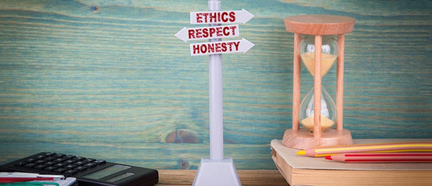 Photo of signpost that says "ethics, respect, honesty"