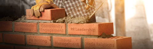 Bricks with the names of PR courses on them.