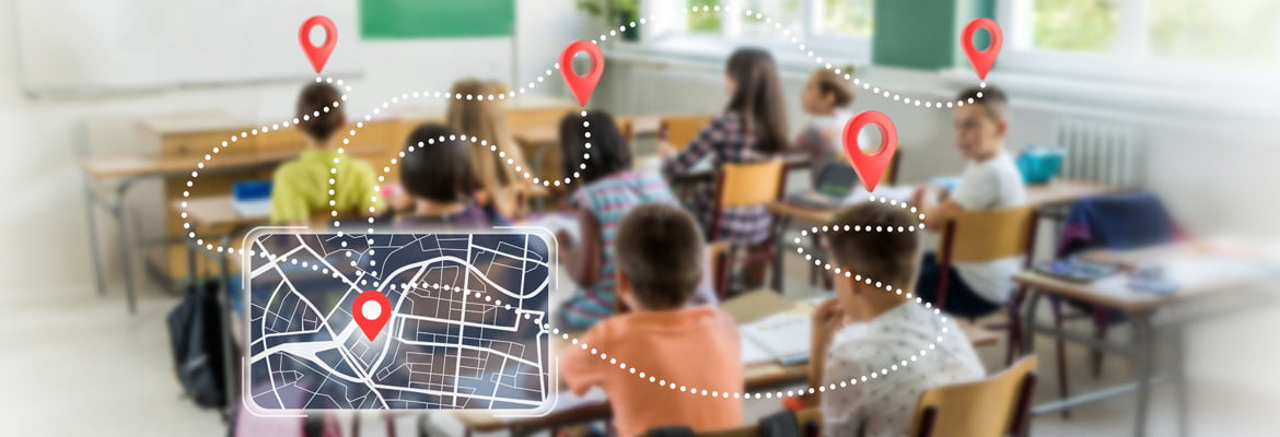 A blurred photo of children actively learning in a classroom. Overlaid a tablet showing navigation icons to symbolize navigating the wide needs of literacy in the classroom