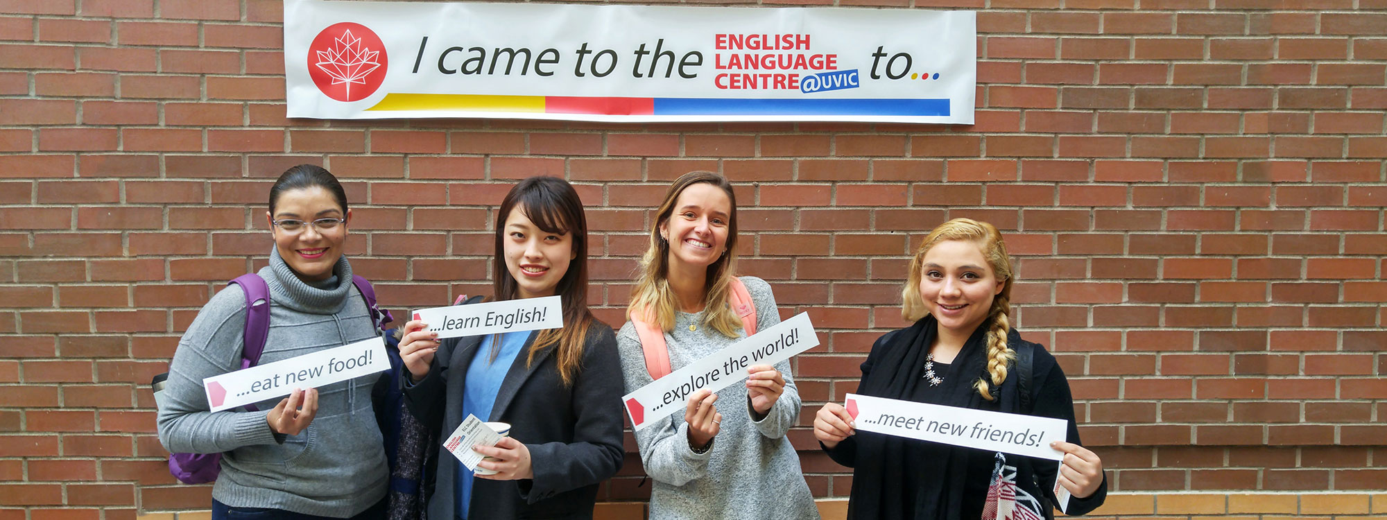 ELC students holding up signs