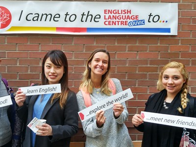 Students posing in front of ELC banner