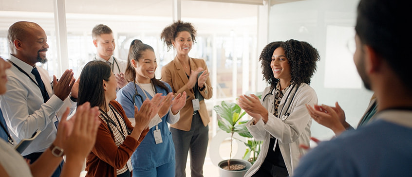 Close-up of a dental procedure with gloved hands holding dental instruments near a patient’s mouth, representing professional healthcare training and clinical practice.
