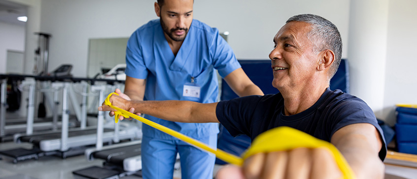 Healthcare worker tends to elderly patient