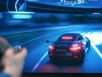 Close up on man's hands at home, sitting on a couch in stylish loft apartment and playing an racing video game on console.