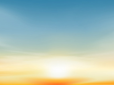 Sun rising through golden, yellow mist into a bright blue sky.