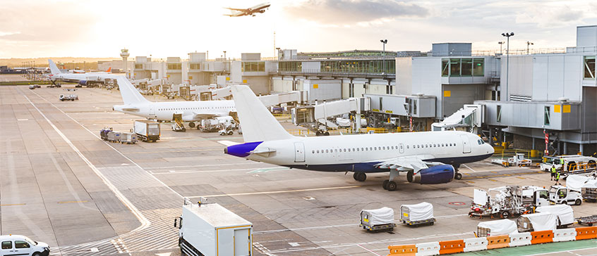 Photo of airplane at terminal.