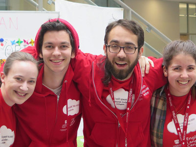 Cultural Assistance in recognizable red shirts.