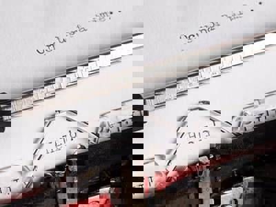 A close-up shot of an old-fashioned typewriter with a piece of white paper inserted. At the top of the visible paper, the phrase "Once upon a time..." is typed. Further down, in the center, the word "Hello!" is typed. The metal components of the typewriter, including the platen and type guide, are in sharp focus. The image evokes the act of writing, self-reflection, and the beginning of a narrative