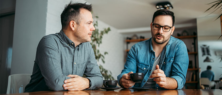 Two men talking about climate change. 