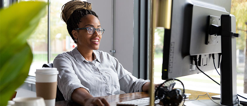 Woman doing online course at computer