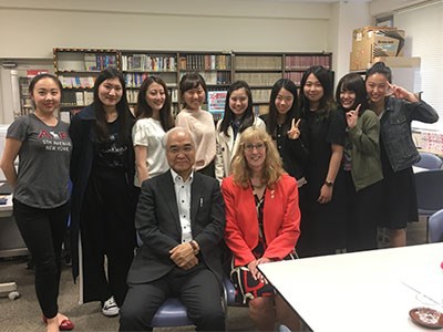Photo of Jackie, in Japan with a university instructor and student group