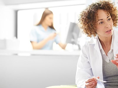 Image of a pharmacist advising a patient